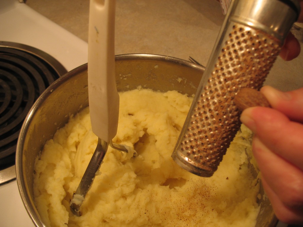 IMG_0355 grating nutmeg into the mashed parsnip potatoes