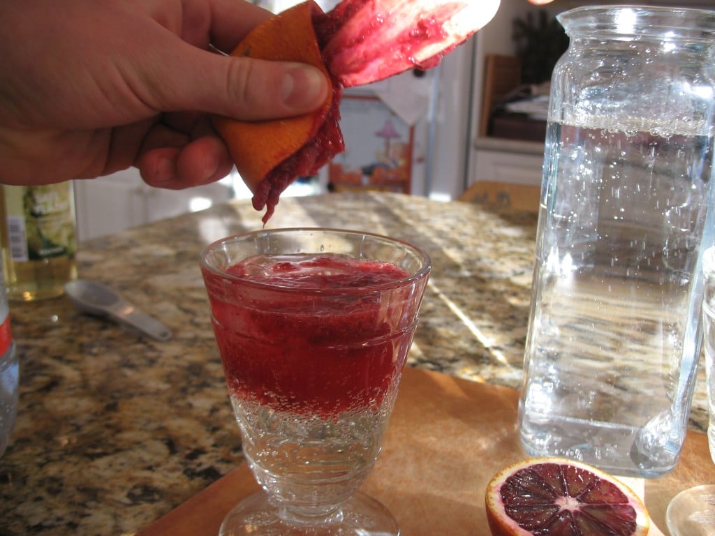 squeezing the blood orange