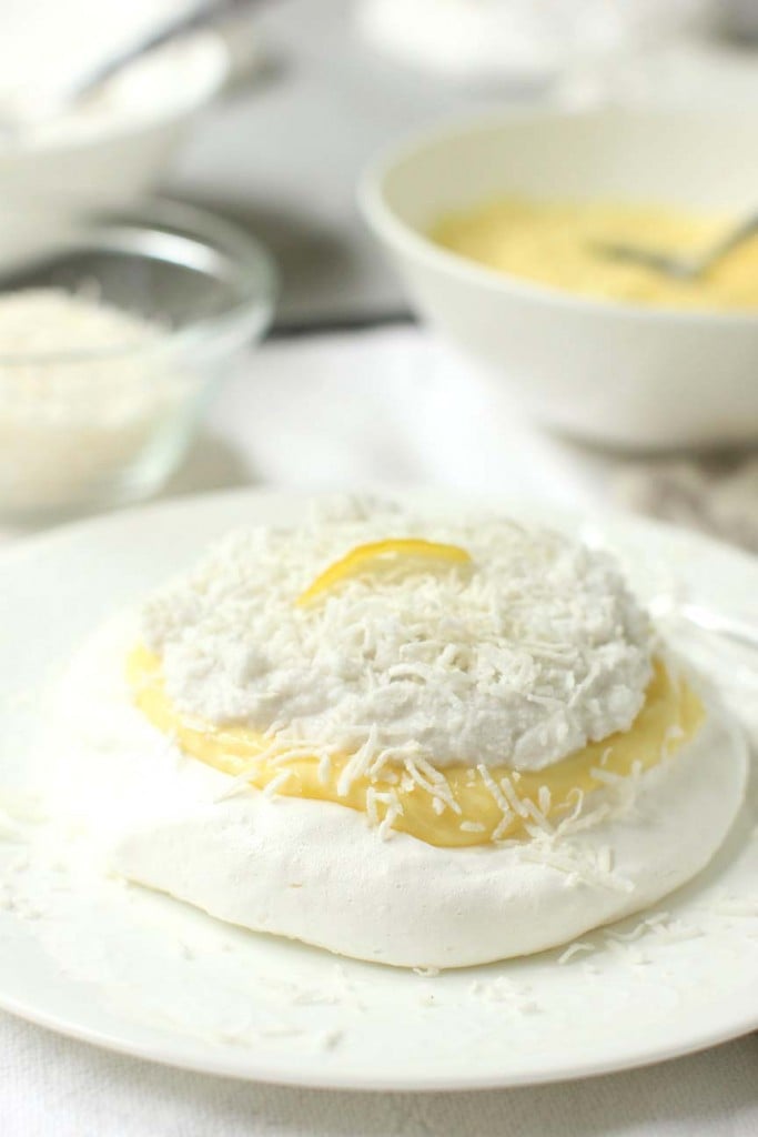 mini coconut pavlova on white plate, for diner en blanc