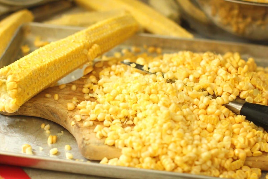 cutting the corn kernels from the cob