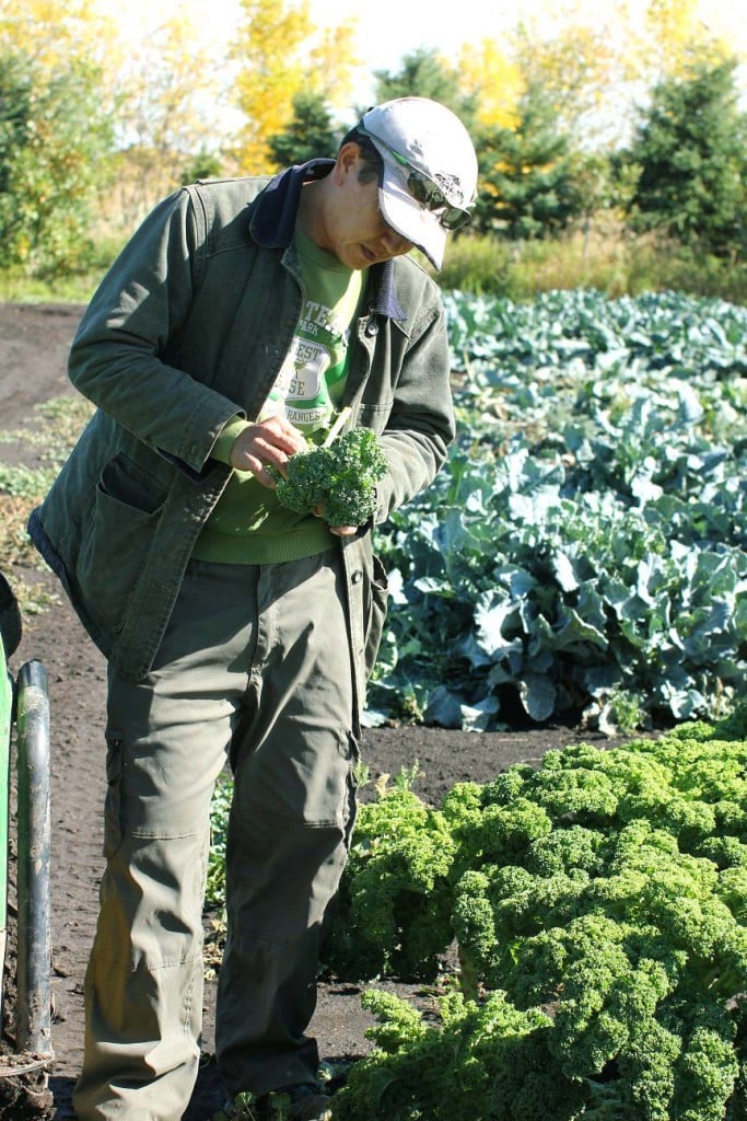 Peas on Earth, Eric examining kale