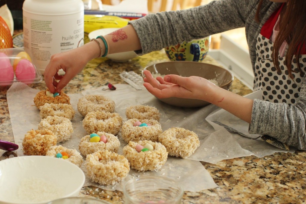 Filling crispy rice Easter egg nests with jelly beans