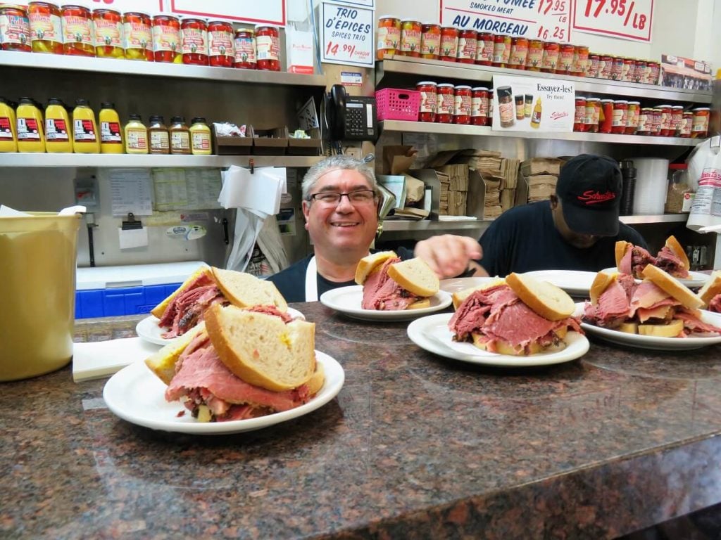 poutine with gluten free gravy; cheerful server at Schwartz's Deli