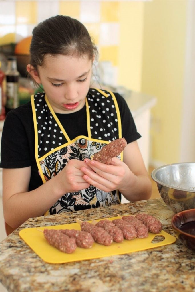 shape the food on a stick into a burger pop