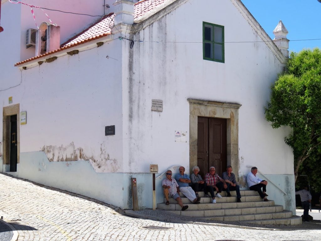 porto tonico; chatting on the steps in Alcoutim