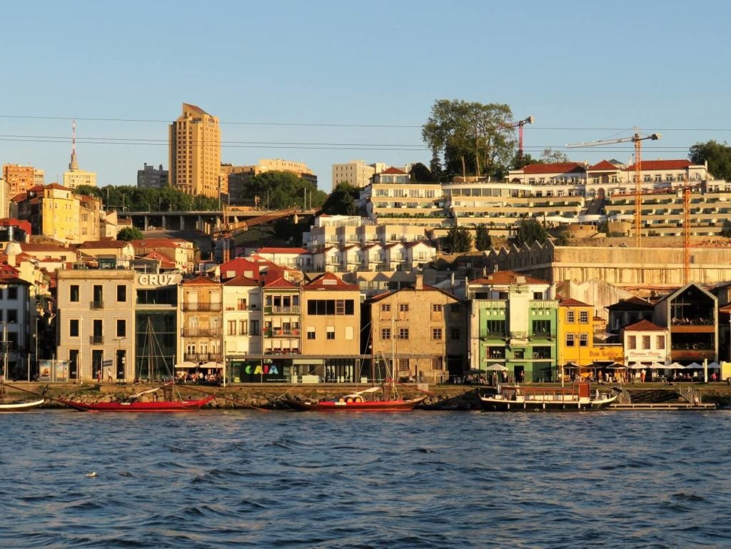 porto tonic; view of the port lodges in Vila Nova de Gaia across the river from Porto in the golden evening light