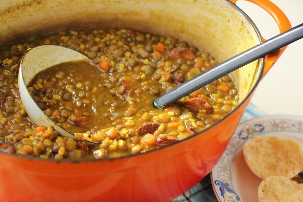 pot of golden lentil soup with ladle