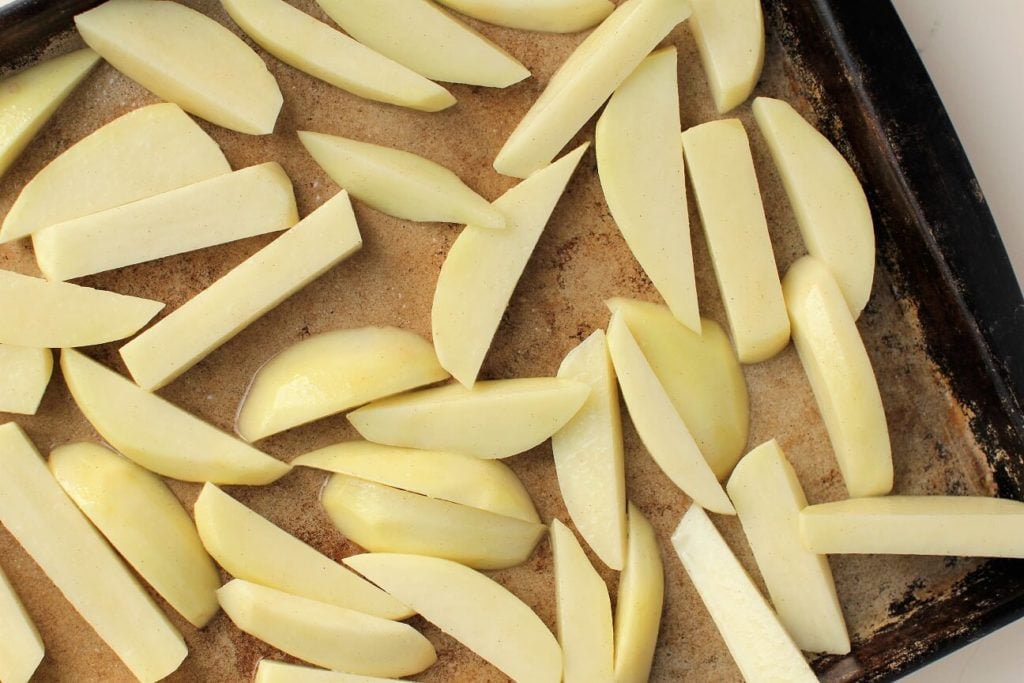gluten free fish and chips; potato fries ready to go into the oven