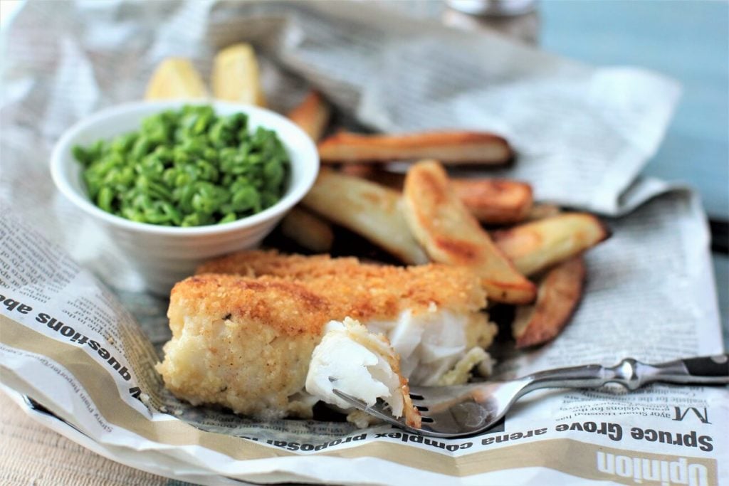 gluten free fish and chips; a forkful of crunchy chip-coated cod