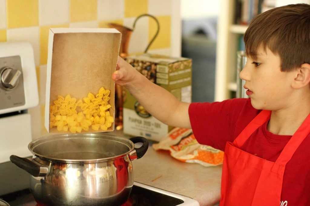 cooking the bow tie noodles for the chicken pasta salad