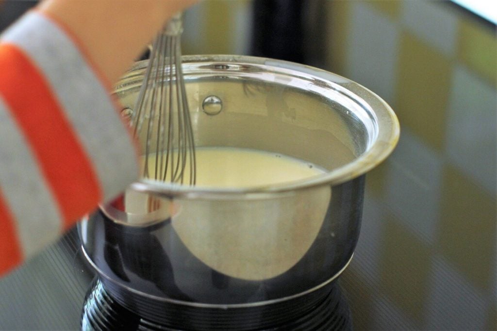 Eric stirs the homemade vanilla pudding