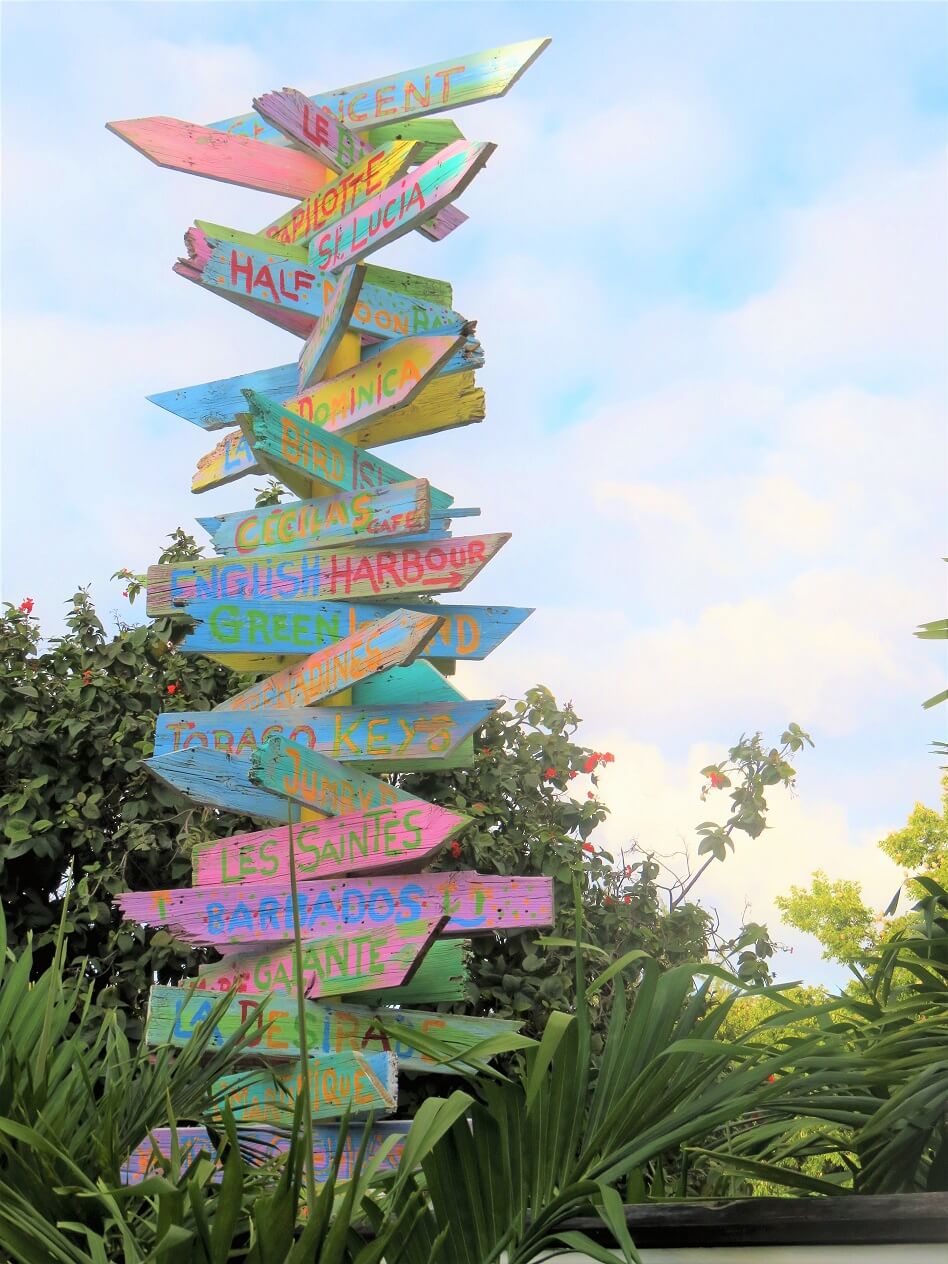 mango salad post - multicoloured signpost in Antigua