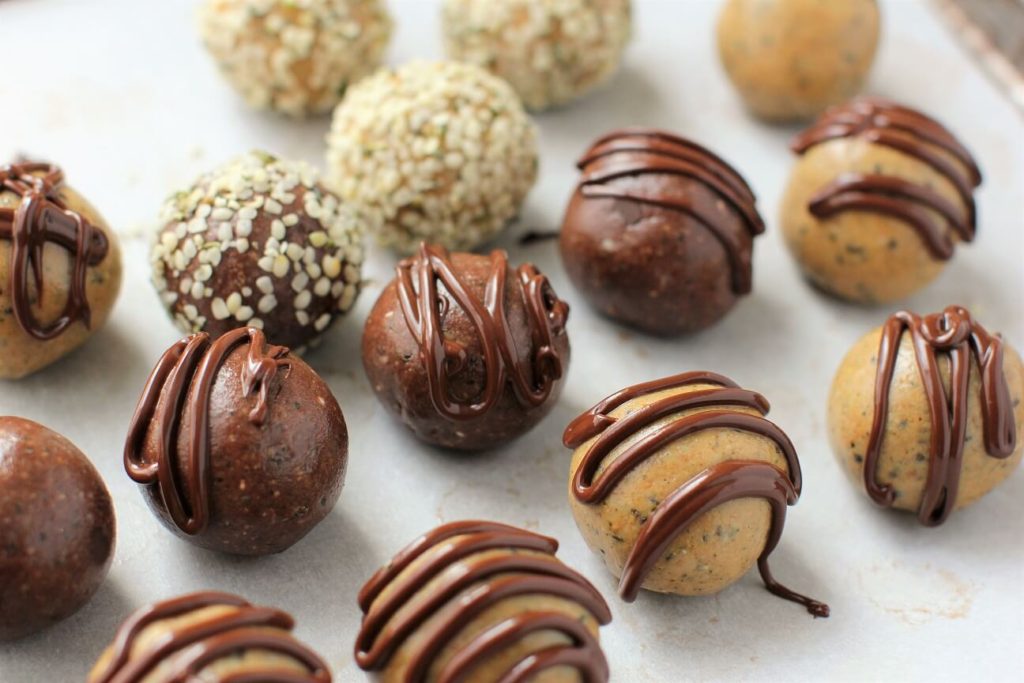 protein balls decorated with chocolate swirls