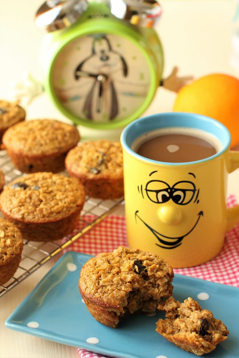 baked oatmeal muffin on a blue polka-dot plate with happy face mug