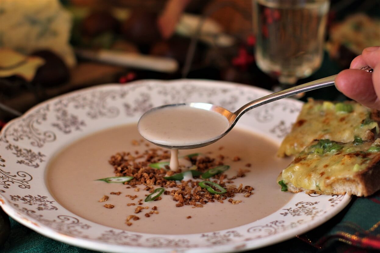 lifting a spoonful of delicate chestnut soup