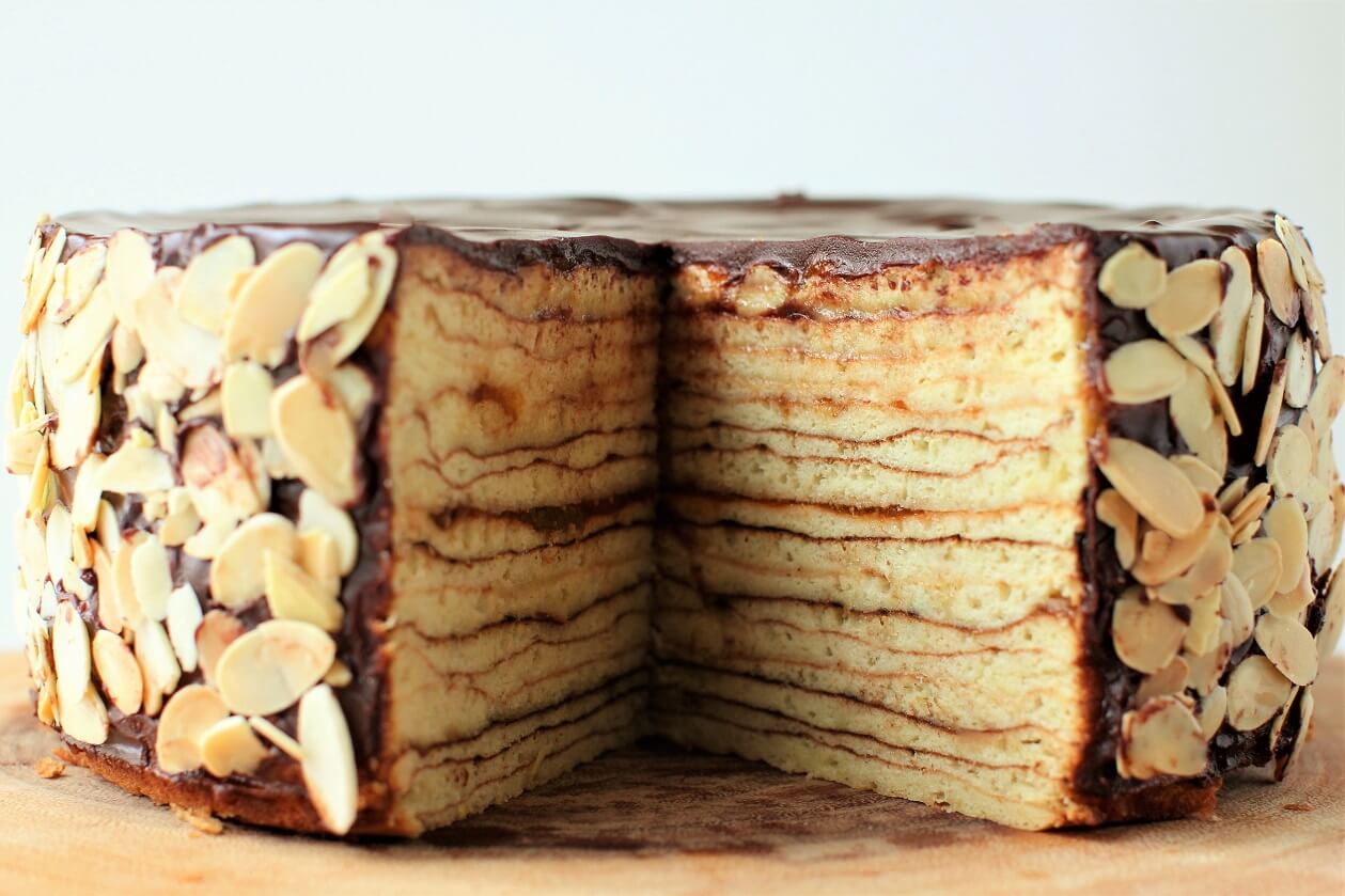 a triangle slab cut out of the baumkuchen so you can see the layers