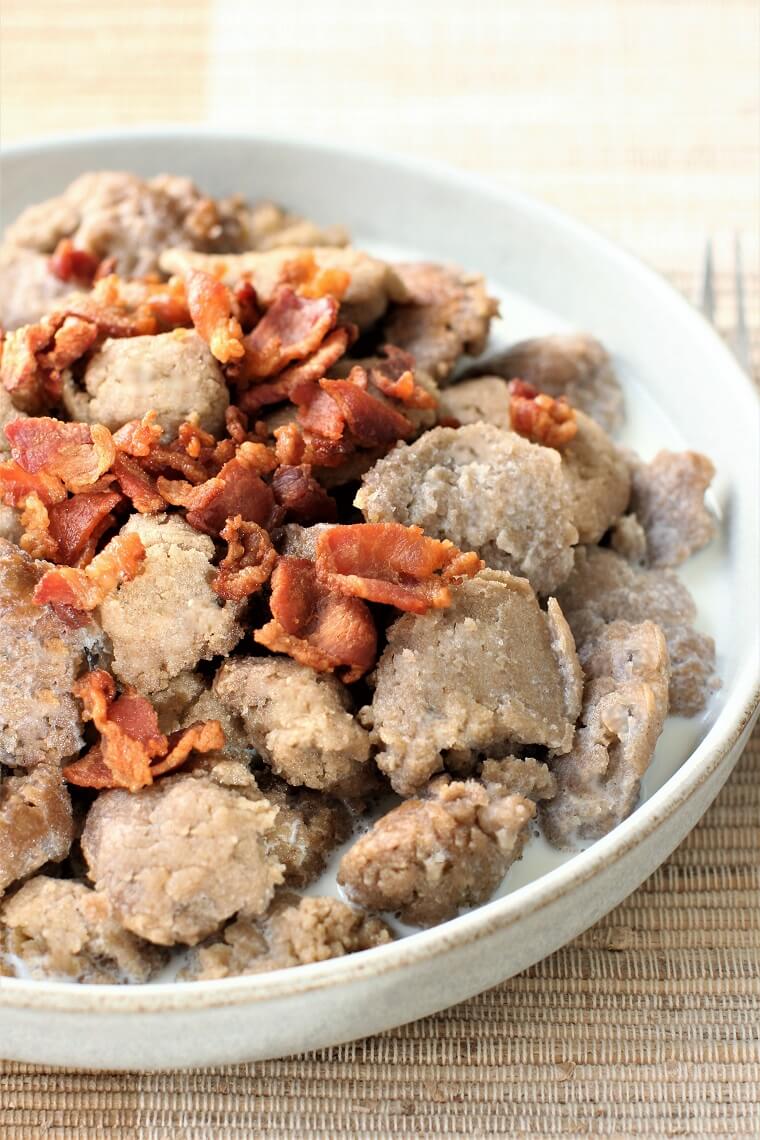 a plate of Stäerzelen, buckwheat dumplings, with bacon and warm milk