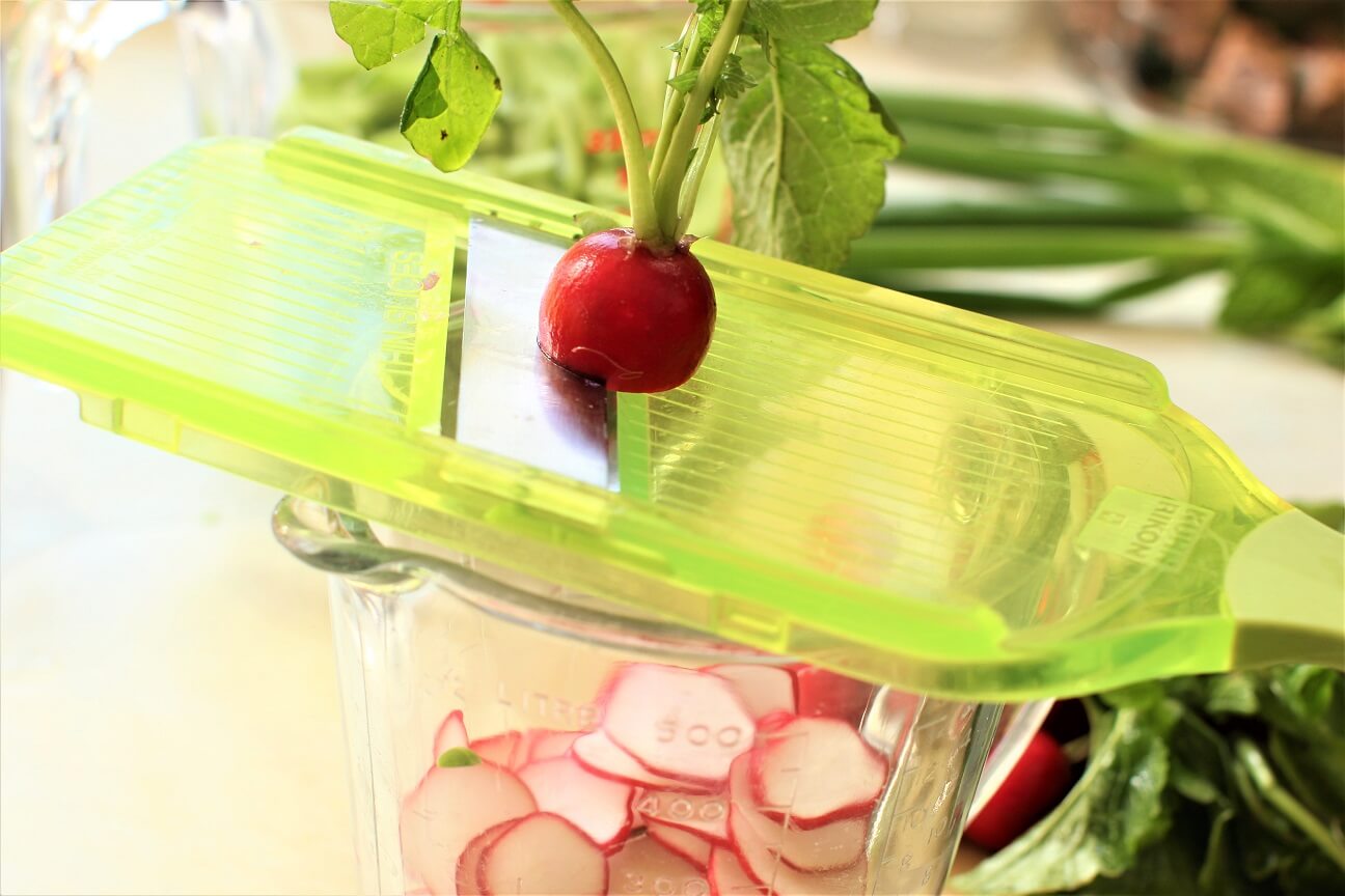 slicing radishes on the mandolin