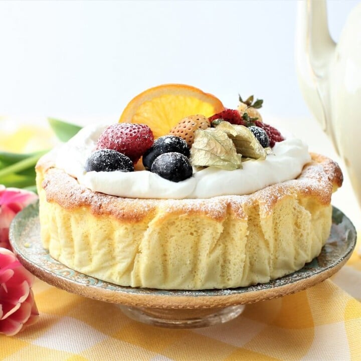 yogurt cake with whipped cream and fresh fruit on top