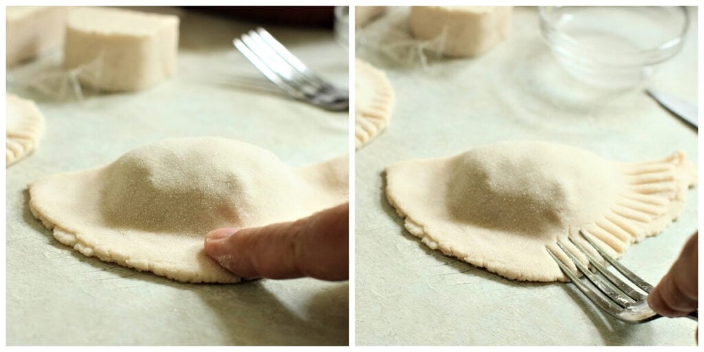 pressing the edges of the empanada together, then crimping them with a fork