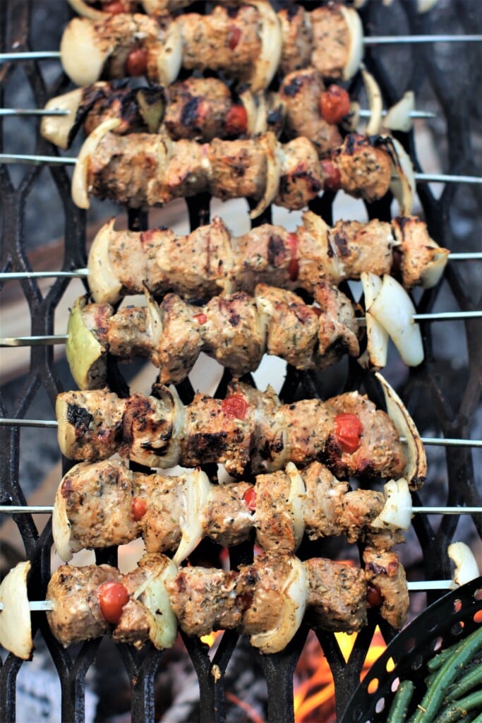 souvlaki skewers lined up on the grill, ready to eat