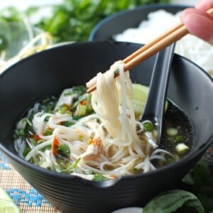 thumbnail photo of chopsticks lifting a mouthful of noodles up out of the bowl of pho soup.