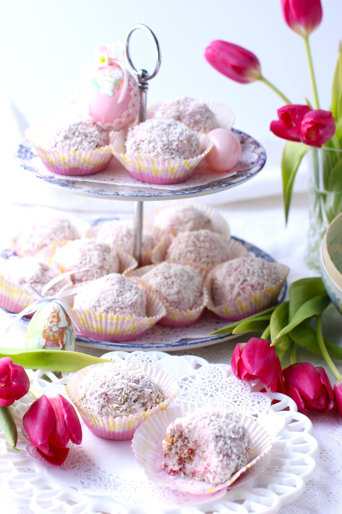 2-tiered stand with Raspberry Schneeballen, two Schneeballen on plate, tulips in vase and on table.