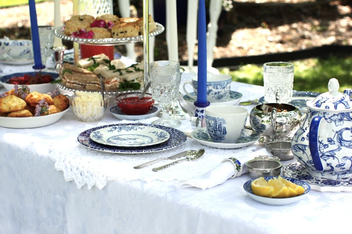 The tea table is set with a mismatched assortment of blue and white china.