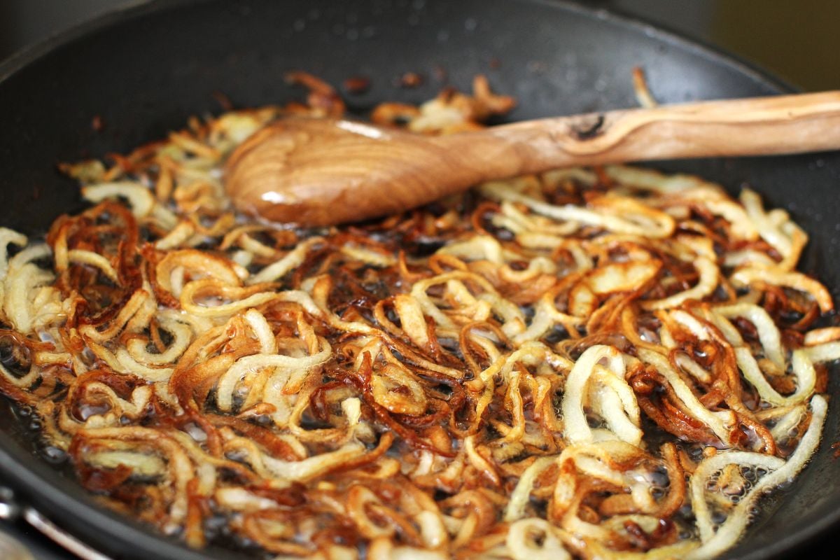 frying sliced onions in oil in a non-stick skillet until browned.