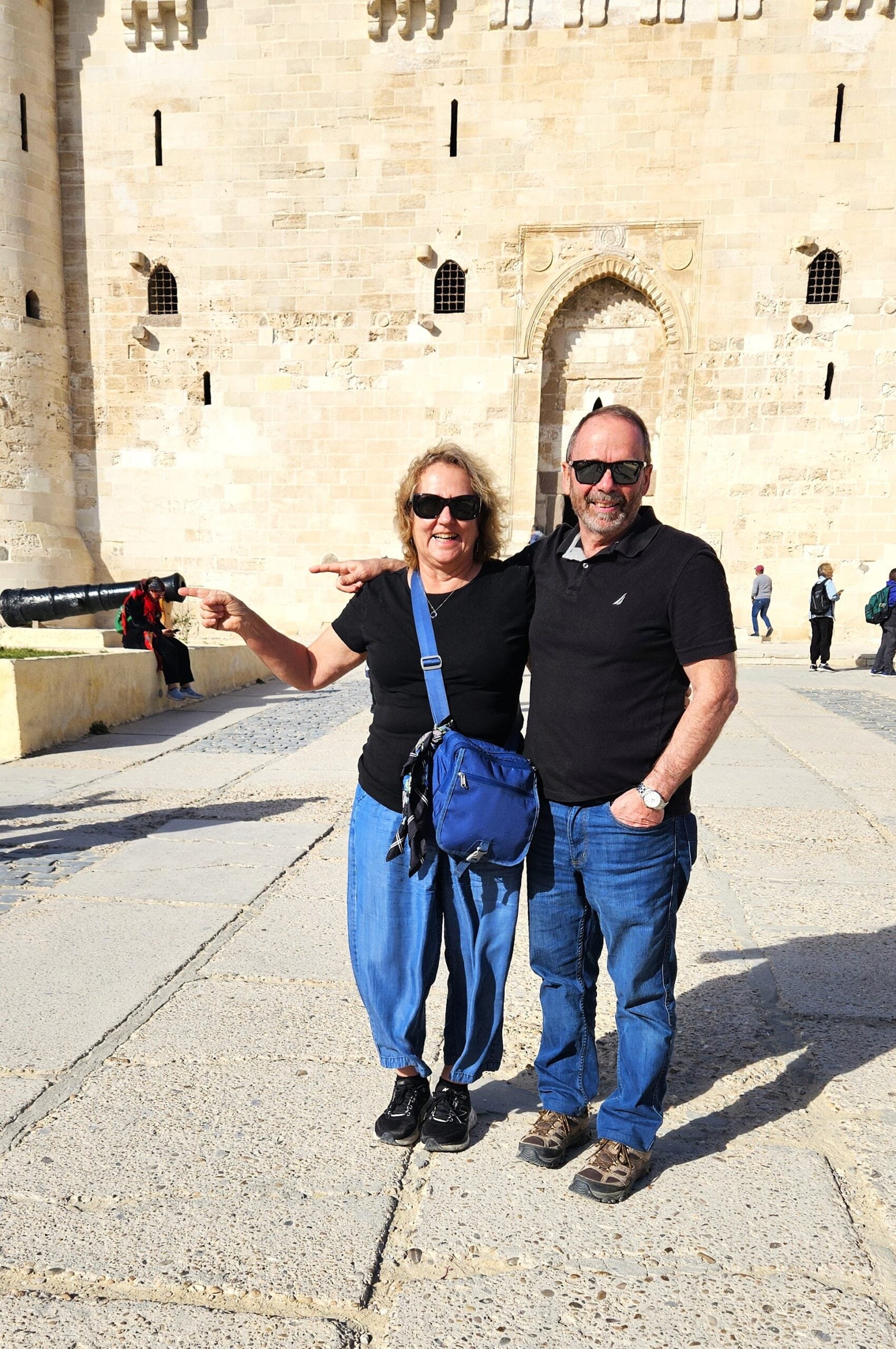 Me and Raymond clowning around at the Qaitbay Citadel. Standing together and pretending to stick our fingers in the canon which is in the background.