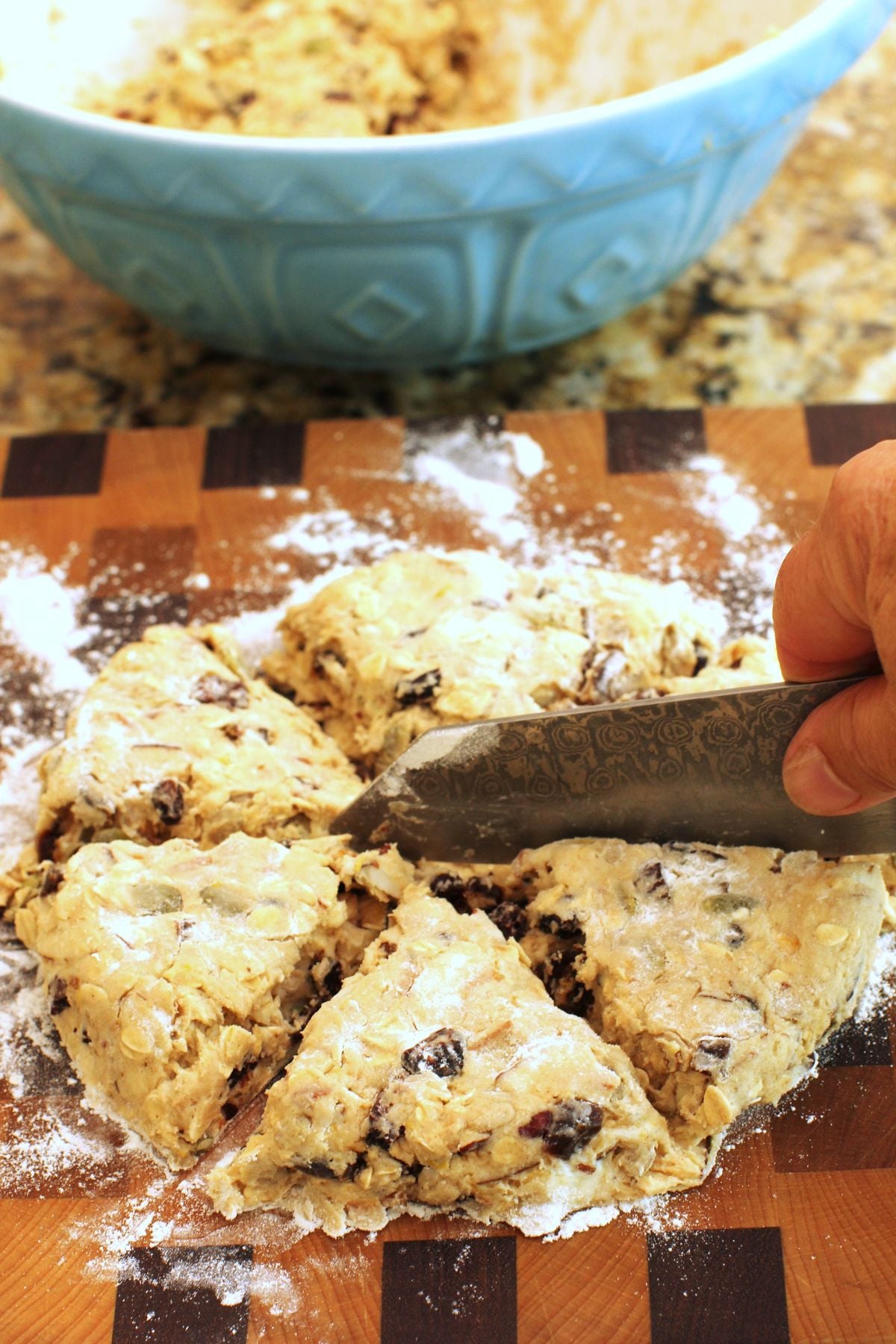 cytting the disc of dough into 6 wedges with a knife.