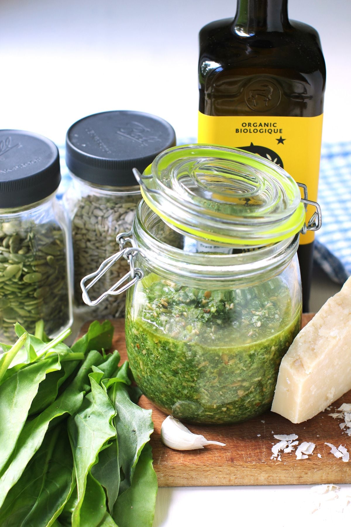 Ingredients for sorrel pesto beside a jar of it.
